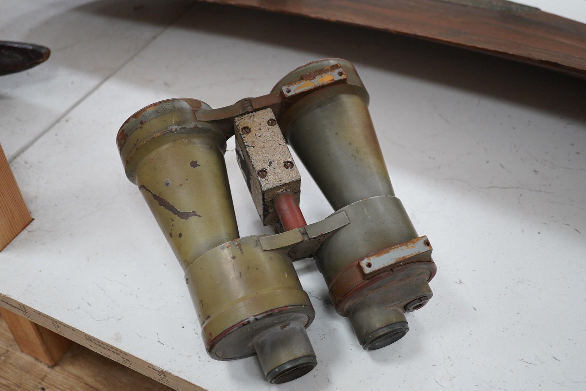 A pair of WWII German U boat coning tower binoculars stamped; U.D.F. 7x50 317971 blc, 20.5cm long. Condition - poor, all lenses damaged, one shattered, and general wear overall.